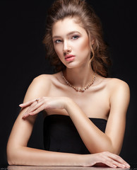 Beauty portrait of luxury fashion elegant woman with glamour gold jewellery, curly hairstyle on...
