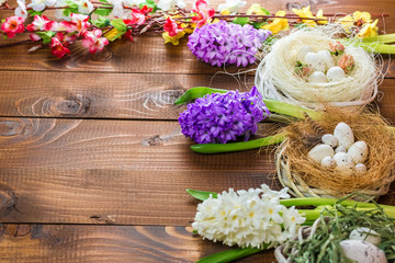 Beautiful Easter eggs with flowers hyacinths on the wooden background