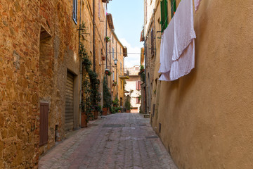 Beautiful narrow alley with traditional historic houses at Montepulciano city