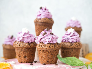 Chocolate muffins with berry cream for a holiday
