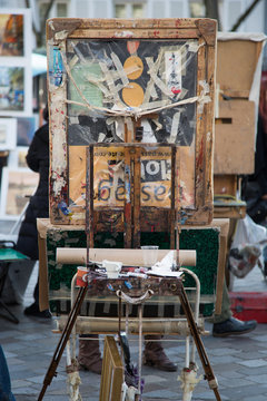 Creative view of painter's easel on Place du Tertre in Montmartre, Paris, France.