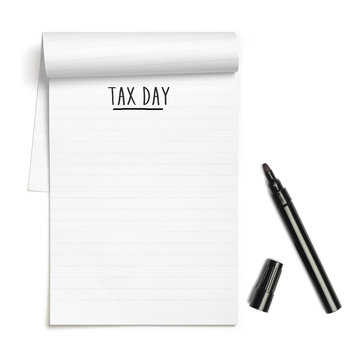 Tax Day on note book with black pen