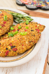 Baked fillets of tilapia coated with tortilla, chipotle and lime crust.
