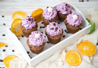 Chocolate muffins with berry cream for a holiday
