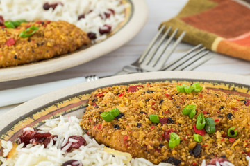 Baked tortilla crusted tilapia with cranberry rice.