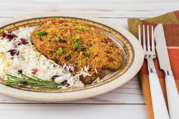 Baked tortilla crusted tilapia with cranberry rice.