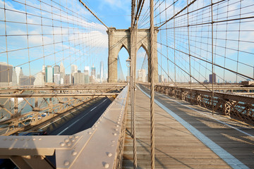 Empty Brooklyn Bridge in a sunny morning, New York