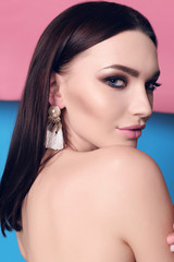 Naklejka premium gorgeous young woman with dark hair and evening makeup