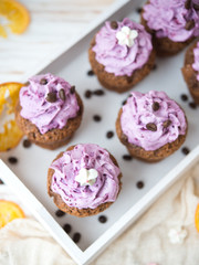 Chocolate muffins with berry cream for a holiday
