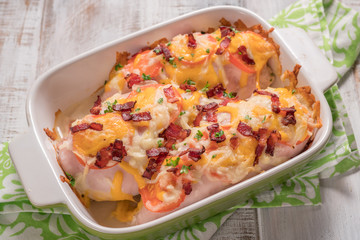 Chicken breast baked with cheese, bacon and tomatoes