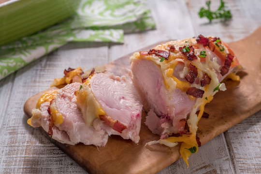 Chicken breast baked with cheese, bacon and tomatoes