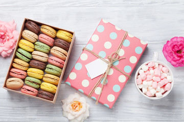 Colorful macaroons in a box and marshmallow