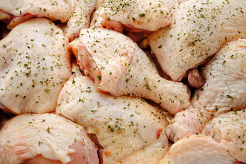 Background of Raw Spiced Chicken Thighs and Legs