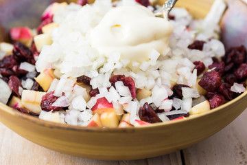 Mixed ingredients for homemade, healthy, beet cranberry, apple salad.