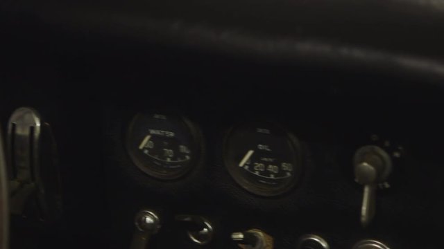 Dashboard of the Classic Jaguar E-type Car. Close-up. Car Ready to Restore