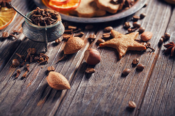 Homemade gingerbread cookies, spices and decorations