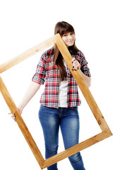 Woman holding an old picture frame over.On a white background