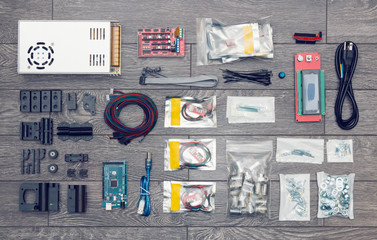 Flat lay of electronic and mechanical parts and components of DIY device