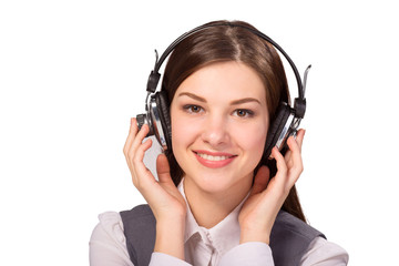 Fototapeta premium Happy young woman listening to music via headphones