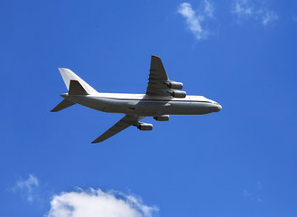 Fototapeta na wymiar Large jet if flight in cloudy sky