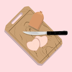 Sausage in  the shape of a heart on the board