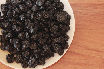 Dried blueberries on a white plate ready to eat