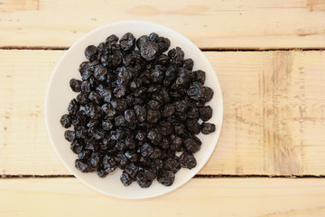 Blueberries on a white plate ready to eat