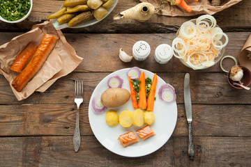 Organic lunch with smoked salmon and boiled potato with carrot. Favorite russian meal for dinner.