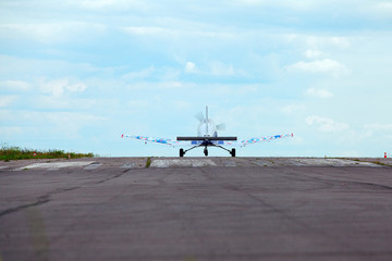 Plane on the runway against the blue sky