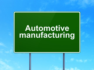 Industry concept: Automotive Manufacturing on road sign background