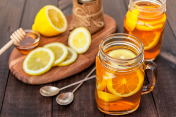 Hot tea with lemon and natural honey, good treat to have vitamins and strong immunity.