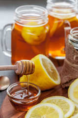 Hot tea with lemon and natural honey, good treat to have vitamins and strong immunity.
