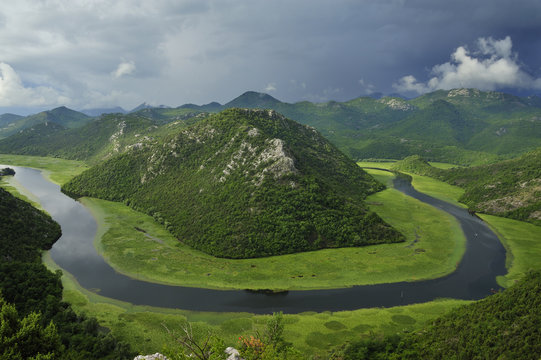 River Crnojevica with a central channel between aquatic plants, flowing round Pavlova Strana, Lake Skadar National Park, Montenegro, June 2009. BOOK & WWE OUTDOOR EXHIBITION.