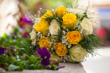 Bridal bouquet of white and yellow roses