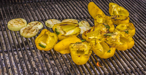 yellow bell pepper and onion slices with a delicious browned crust on the grill