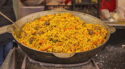 iron cauldron with a delicious pilaf