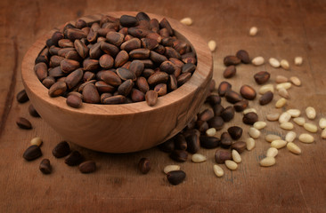 Wooden bowl of pine nuts