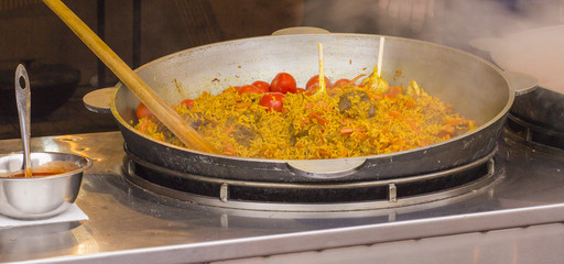 iron cauldron with a delicious pilaf