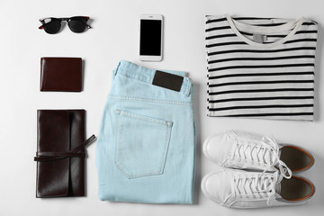 Flat lay set of male clothes and accessories on white background