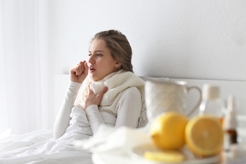 Young ill woman in bed at home