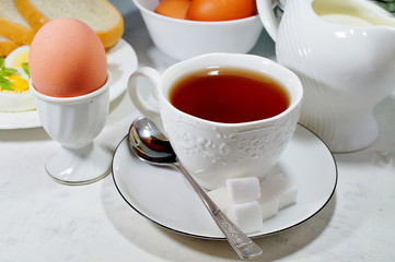 Easter- traditional Easter breakfast - Festive Easter table in white - soft focus, selective focus
