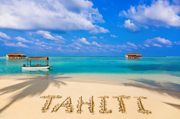 Fototapeta na wymiar Word Tahiti on beach