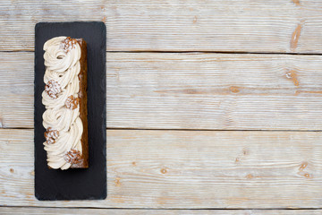 Cake with coffee cream and nuts. Food background, flat lay.
