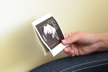 Pregnant woman with ultrasound picture. USG - obrazy, fototapety, plakaty