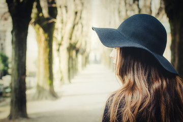 Dark-haired girl alone at cemetery