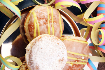 Close up Tasty Sugared Round Berliner Donuts. Carnival for Dessert on Wooden Table