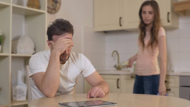 Possessive wife fighting with husband at home, accusing him of cheating, divorce