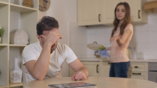 Nervous young woman quarreling with man, annoyed husband ignoring wife, breakup