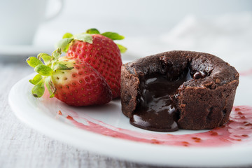 Chocolate souffle with strawberries