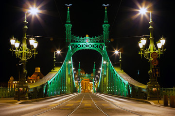 Fototapeta na wymiar Eastern side of Freedom Bridge connecting Buda and Pest across Dunabe River in Budapest, Hungary